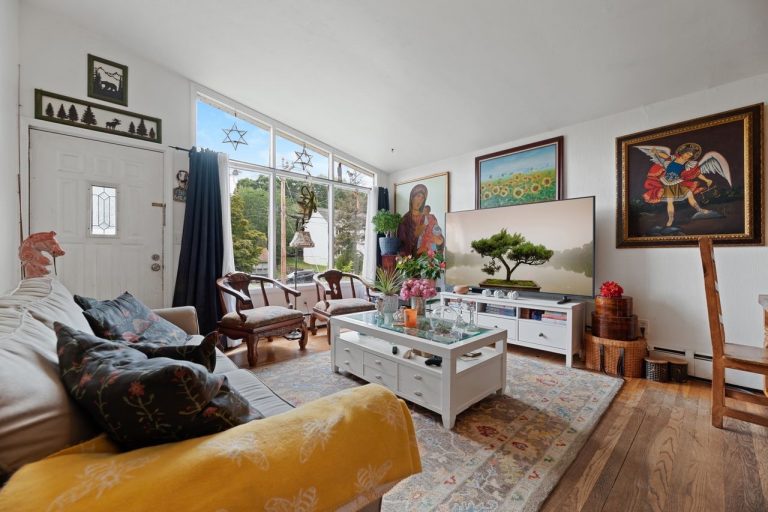 NetPro Agency llc Living room with TV real estate photo by NetPro Agency