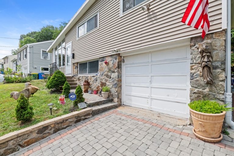 NetPro Agency llc Real estate exterior photo of a home with flag by NetPro Agency